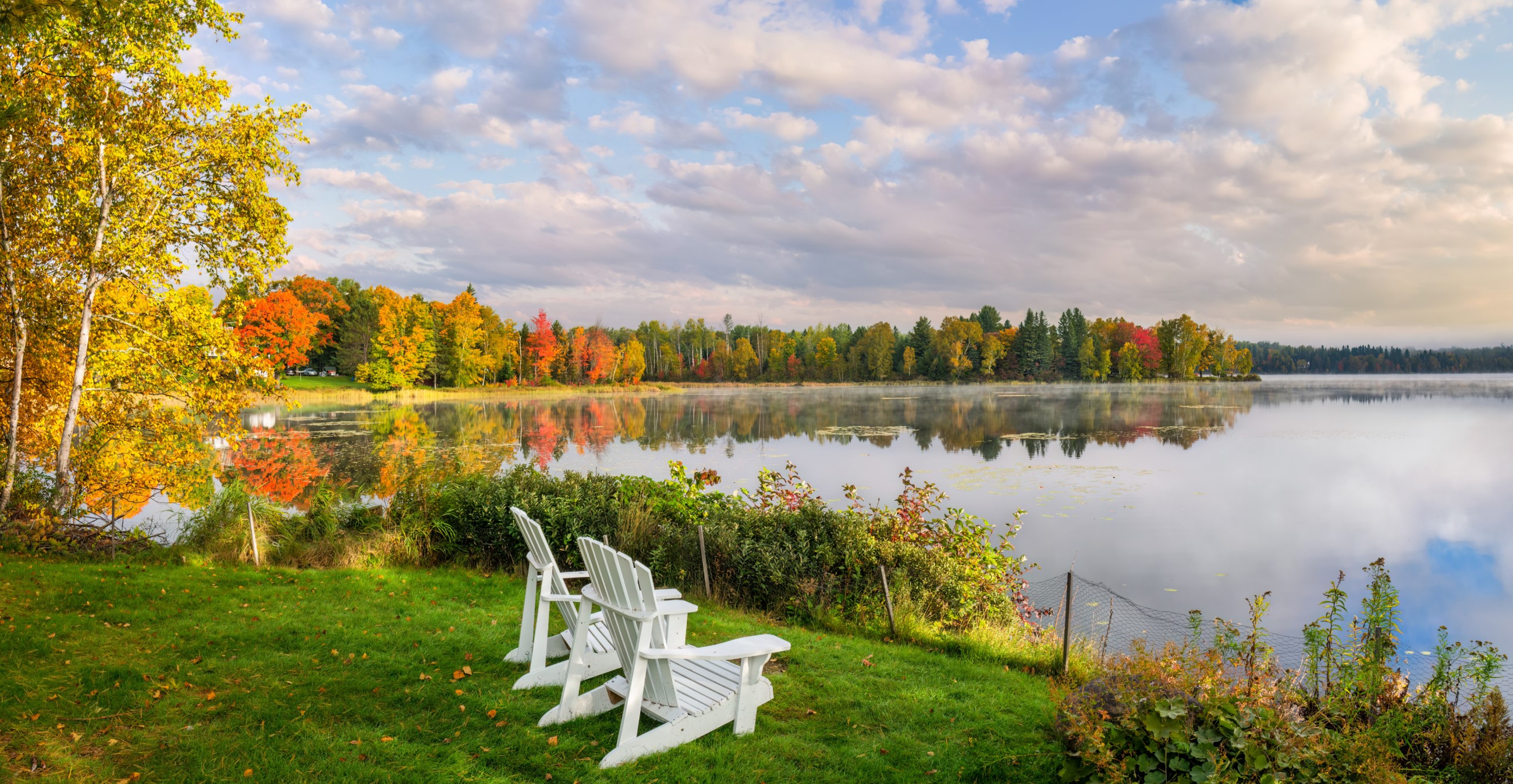 Adirondack Chairs On A Lawn With A View Of Haley Pond At Rangeley, Maine