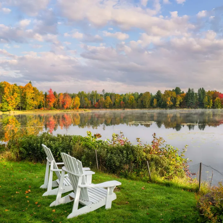 Adirondack Chairs On A Lawn With A View Of Haley Pond At Rangeley, Maine